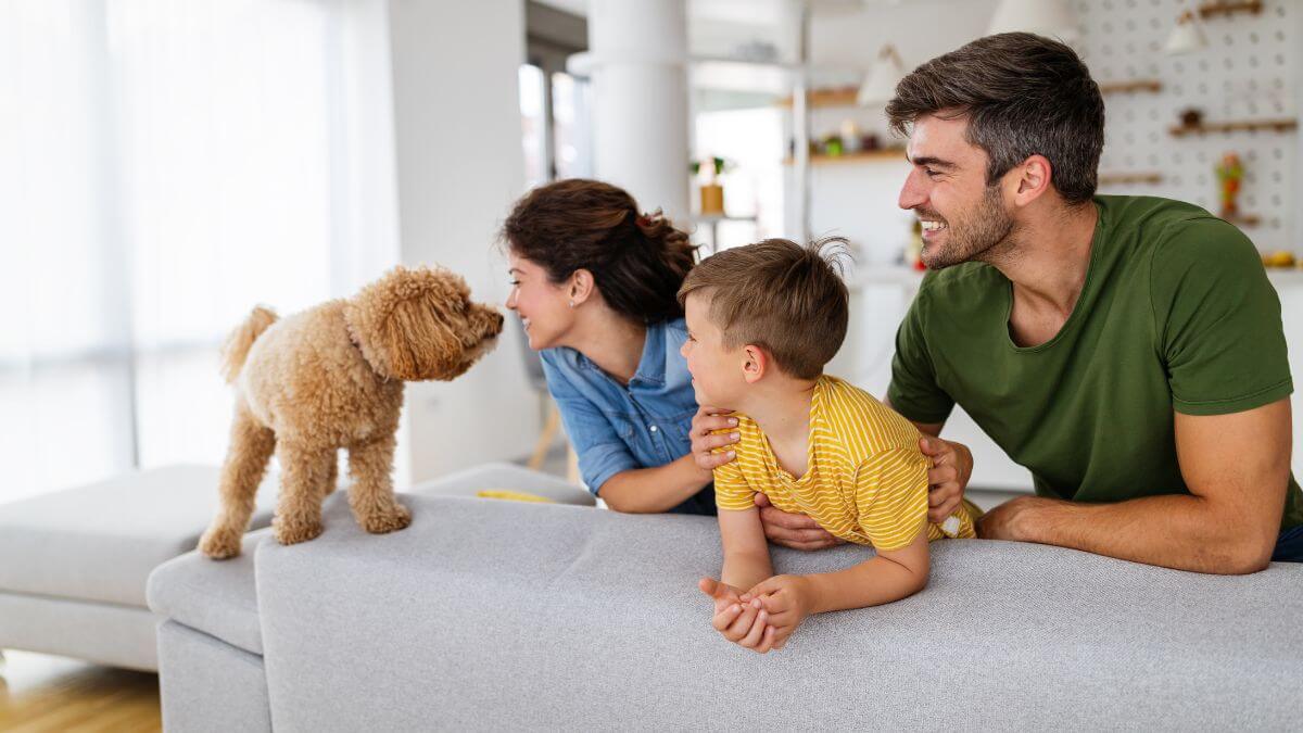 Happy family at home with dog